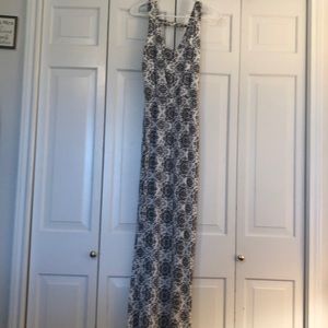 Women’s black and white midi length dress.